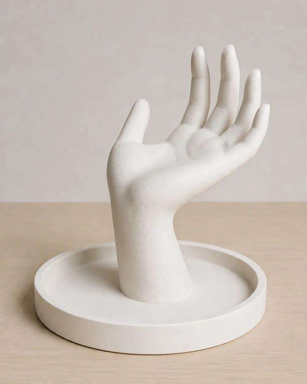 A ring holder in the shape of a hand.