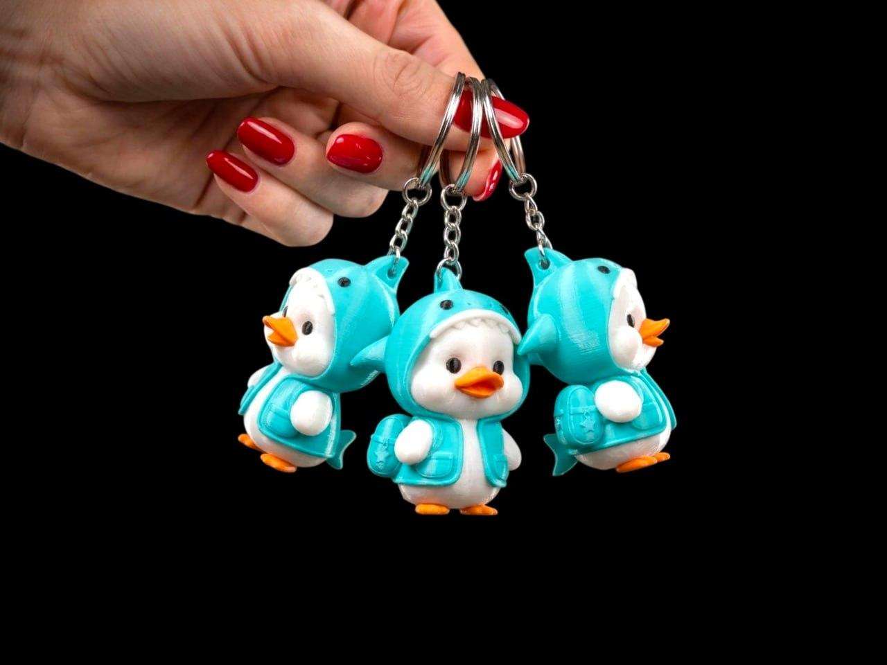 A cute duck in a shark costume.