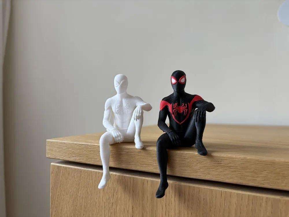 A figurine of Miles Morales, sitting on the shelf.