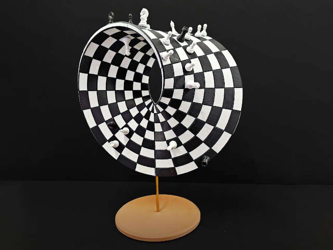 A Möbius strip chessboard + chess pieces.