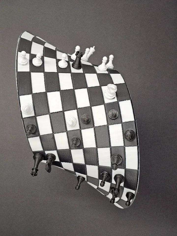 A Möbius strip chessboard + chess pieces.