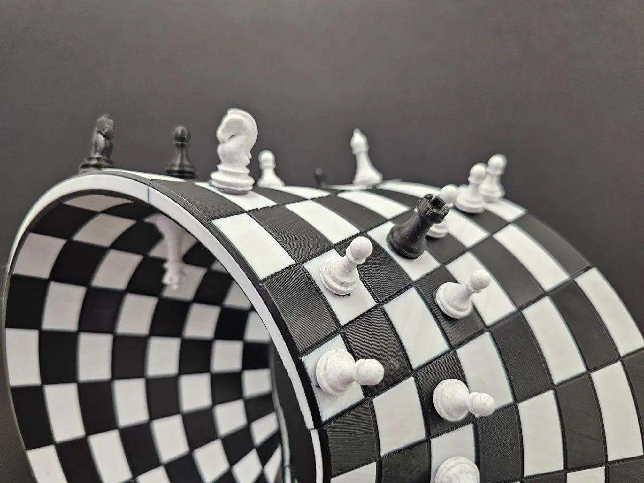 A Möbius strip chessboard + chess pieces.