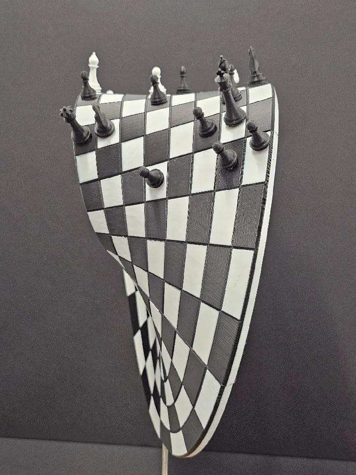 A Möbius strip chessboard + chess pieces.